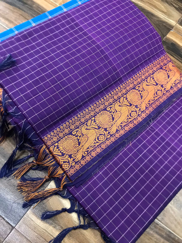 Spun cotton with tiny checks and single border with fantabulous peacock design
