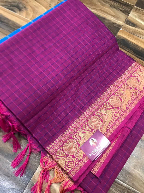 Spun cotton with tiny checks and single border with fantabulous peacock design