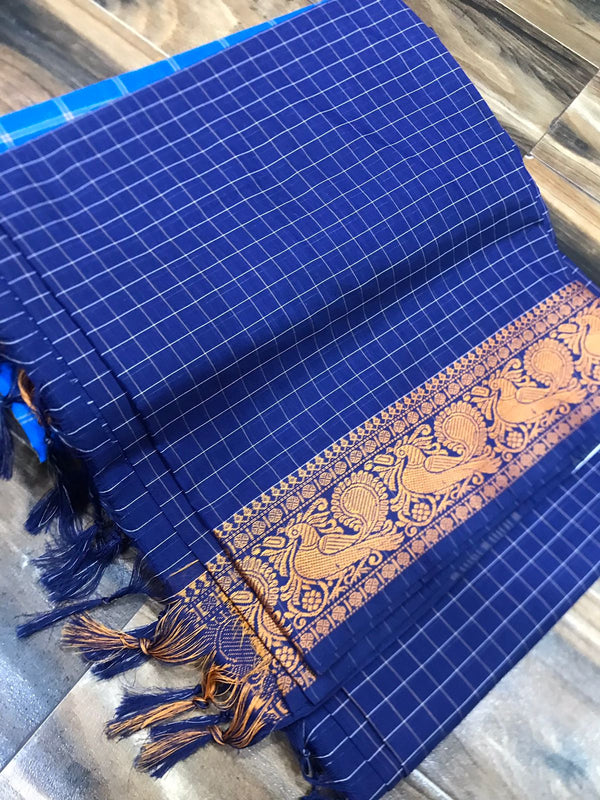 Spun cotton with tiny checks and single border with fantabulous peacock design