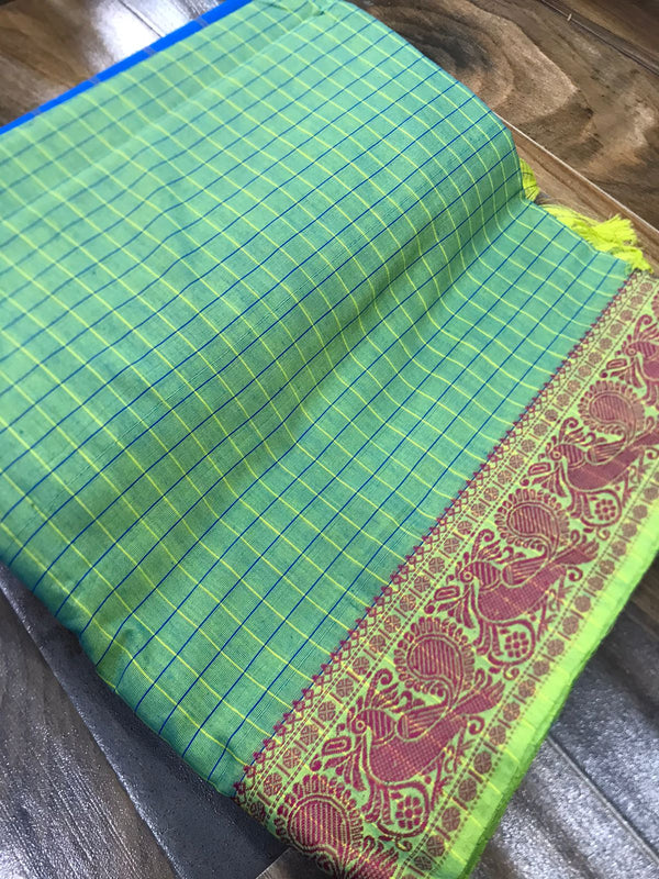 Spun cotton with tiny checks and single border with fantabulous peacock design