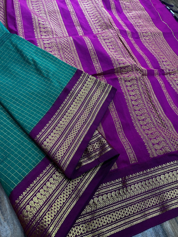 Kalyani checks with dark colours tiny peacock design in lovely border