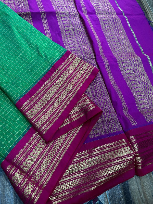 Kalyani checks with dark colours tiny peacock design in lovely border