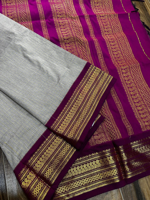 Kalyani checks with dark colours tiny peacock design in lovely border