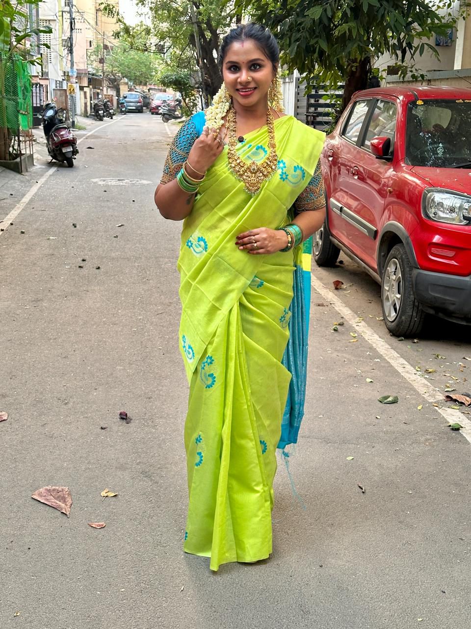 Parrot Green Semi Silk Saree with Blue Motifs