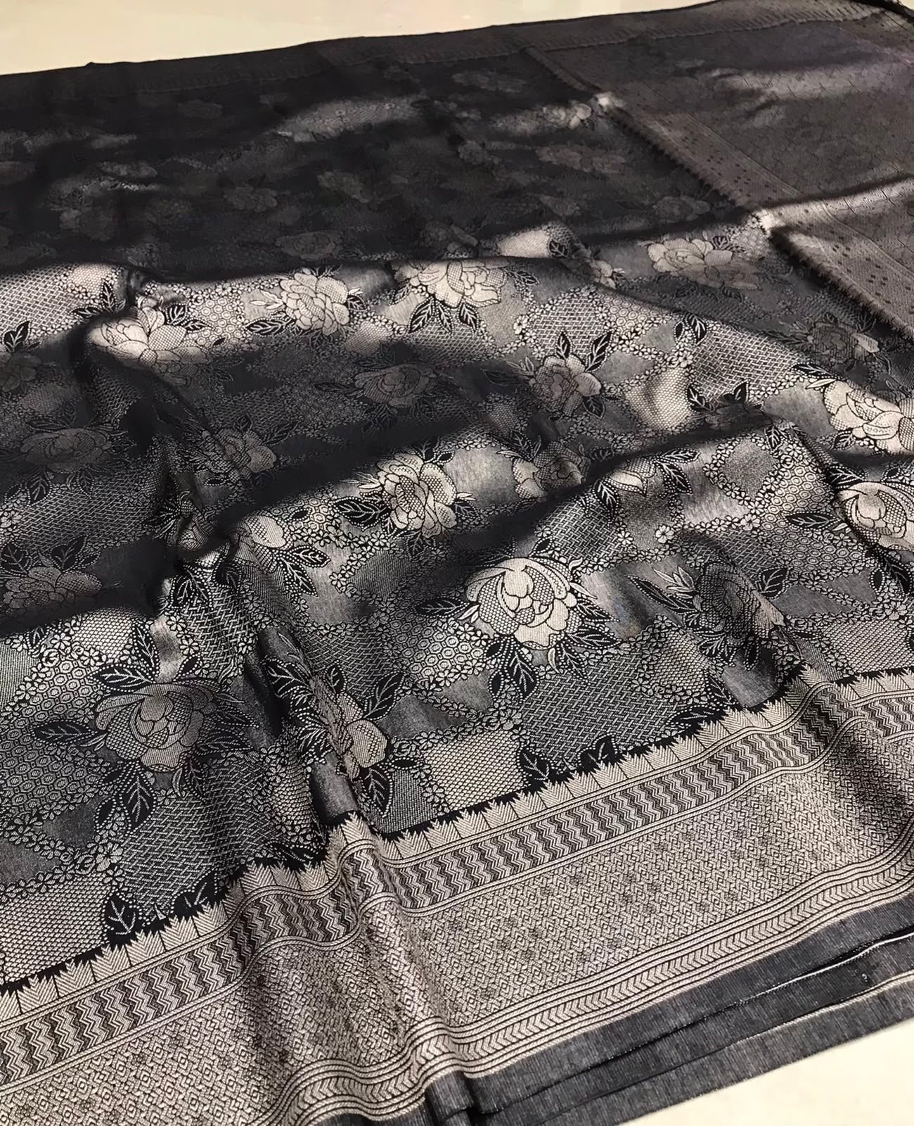 Soft Silk Saree – Midnight Black with Silver Floral Zari Weaving & Rich Designer Border